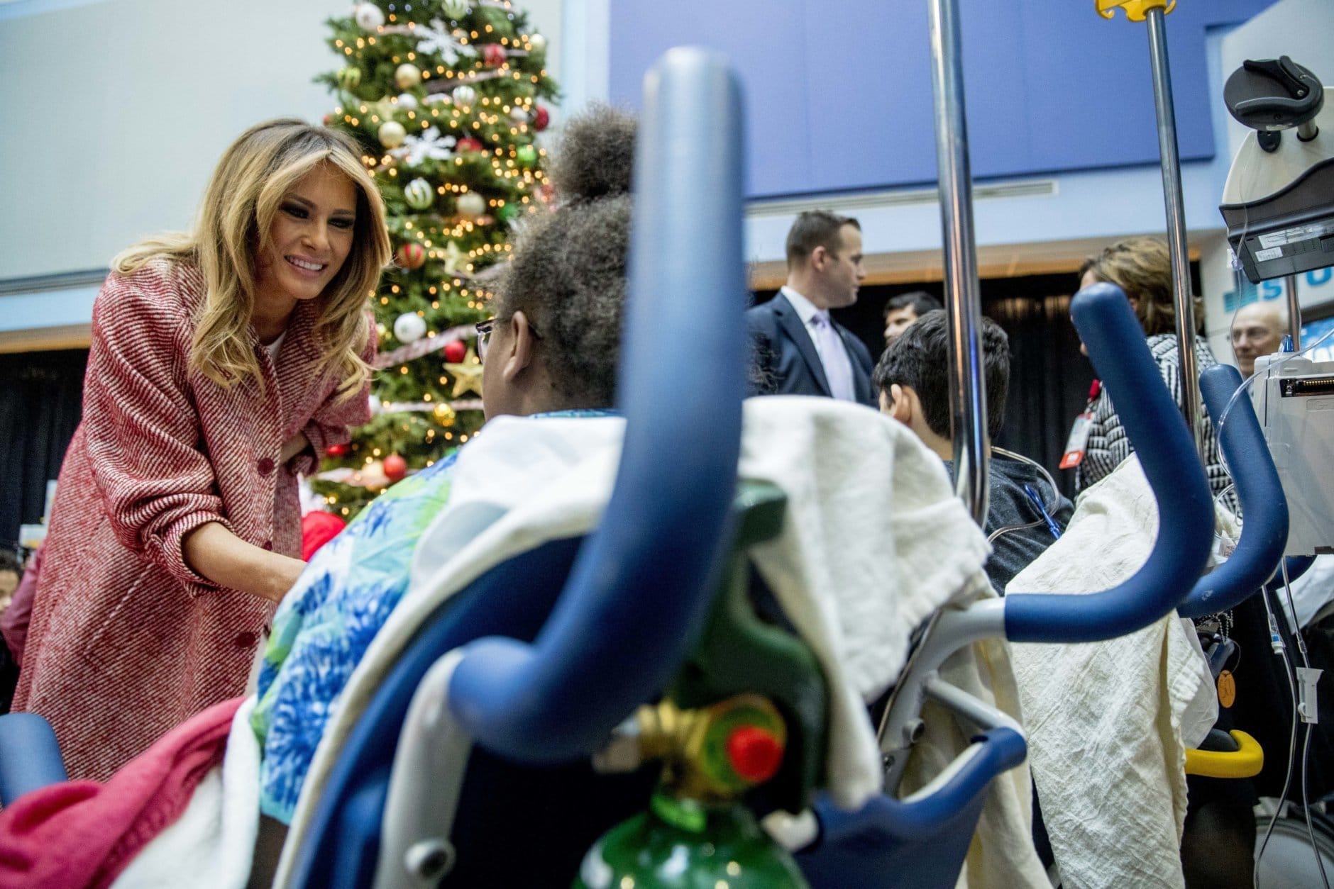 First lady Melania Trump greets patients in the audience after reading "Oliver the Ornament" to children at Children's National Health System, Thursday, Dec. 13, 2018, in Washington. (AP Photo/Andrew Harnik)