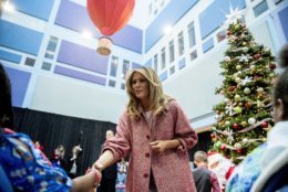 First lady Melania Trump greets patients in the audience after reading "Oliver the Ornament" to children at Children's National Health System, Thursday, Dec. 13, 2018, in Washington. (AP Photo/Andrew Harnik)