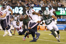 Houston Texans quarterback Deshaun Watson (4) scrambles against the New York Jets during the first half of an NFL football game, Saturday, Dec. 15, 2018, in East Rutherford, N.J. (AP Photo/Adam Hunger)