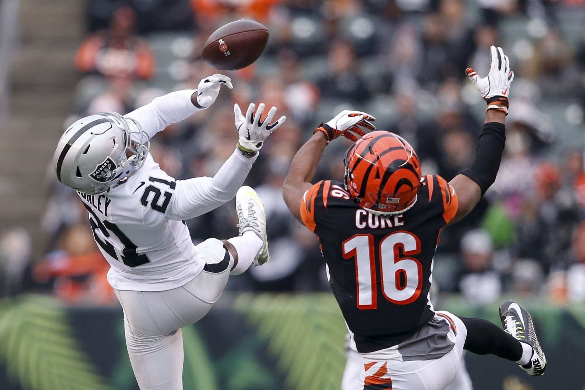 Oakland Raiders cornerback Gareon Conley (21) misses a pass contested by Cincinnati Bengals wide receiver Cody Core (16) in the second half of an NFL football game, Sunday, Dec. 16, 2018, in Cincinnati. (AP Photo/Gary Landers)