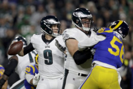 Philadelphia Eagles quarterback Nick Foles passes against the Los Angeles Rams during the first half in an NFL football game Sunday, Dec. 16, 2018, in Los Angeles. (AP Photo/Marcio Jose Sanchez)
