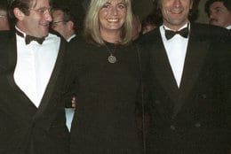 FILE - In this Dec. 17, 1990 file photo, director Penny Marshall poses with co-stars of "Awakenings" Robin Williams, left, and Robert De Niro at the premiere of the film in New York. Marshall died of complications from diabetes on Monday, Dec. 17, 2018, at her Hollywood Hills home. She was 75. (AP Photo/Chrystyna Czajkowsky, File)