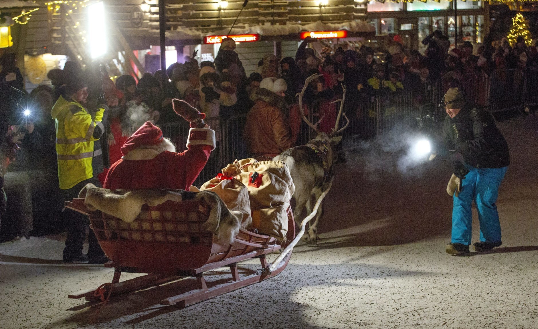 A person dressed up as Santa sits in a slay, as he leaves Santa's Village at the Arctic Circle, Rovaniemi, Finnish Lapland, Sunday, Dec. 23, 2018. (Laura Haapam'ki/Lehtikuva via AP)