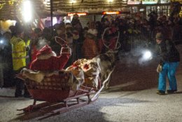 A person dressed up as Santa sits in a slay, as he leaves Santa's Village at the Arctic Circle, Rovaniemi, Finnish Lapland, Sunday, Dec. 23, 2018. (Laura Haapam'ki/Lehtikuva via AP)
