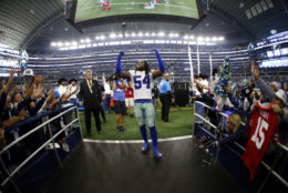 Dallas Cowboys linebacker Jaylon Smith (54) acknowledges cheers from fans as he walks off the field after their 27-20 win over the Tampa Bay Buccaneers in an NFL football game in Arlington, Texas, Sunday, Dec. 23, 2018. (AP Photo/Ron Jenkins)