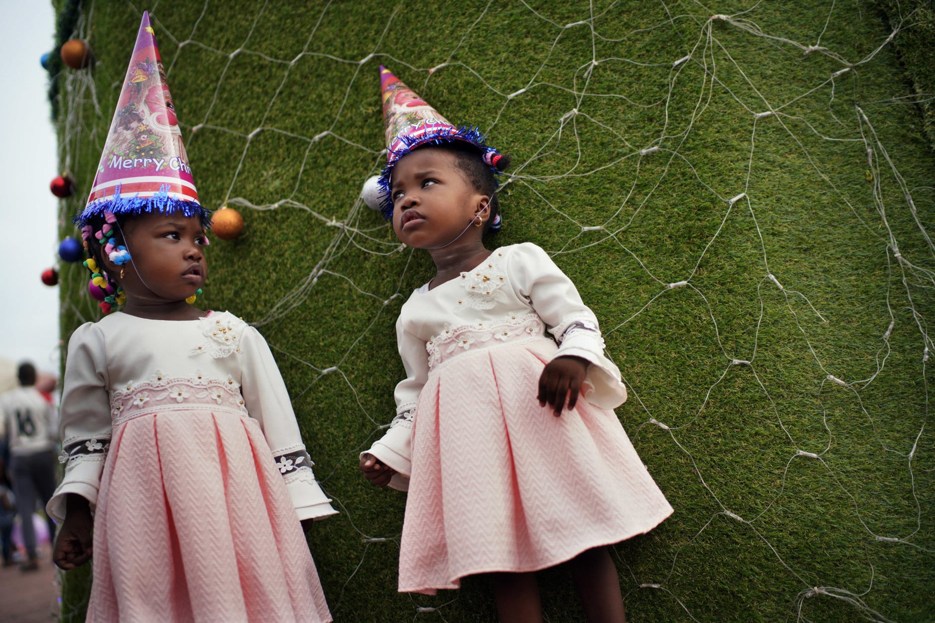 Congolese children pose in Kinshasa, Congo, Tuesday Dec. 25, 2018. Traditionally Congolese dress up and take to the parks on Christmas day, this time five days before scheduled presidential and general elections. (AP Photo/Jerome Delay)