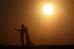 A couple takes a selfie photo during the last sunset of the year in Naypyitaw, Myanmar, Monday, Dec. 31, 2018. (AP Photo/Aung Shine Oo)