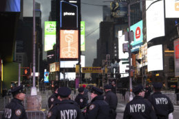 Police assemble in New York's Times Square before patrolling on New Year's Eve, Monday, Dec. 31, 2018. (AP Photo/Mark Lennihan)