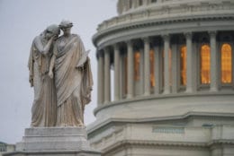 The lights in the Capitol Dome glow behind the Peace Monument statue in Washington, Monday, Dec. 31, 2018, as a partial government shutdown stretches into its second week. A high-stakes move to reopen the government will be the first big battle between Nancy Pelosi and President Donald Trump as Democrats come into control of the House. The new Democratic House majority gavels into session this week with legislation to end the government shutdown. Pelosi and Trump both think they have public sentiment on their side in the battle over Trump's promised U.S.-Mexico border wall. (AP Photo/J. Scott Applewhite)