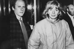 Actress Penny Marshall and singer-composer-actor Art Garfunkel arrive at the Uris Theater in New York City, Feb. 17, 1981. They were arriving to attend a performance of the revival of Gilbert and Sullivan's "Pirates of Penzance." (AP Photo/Steve Sands)