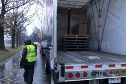Trucks unloaded wreaths starting at about 9 a.m. (WTOP/Kristi King)