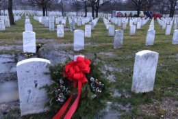 Volunteers laid wreaths across the Arlington National Cemetery. (WTOP/Kristi King)