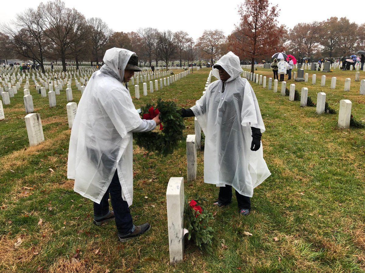 A family honors their grandfather, who served in WWII. (WTOP/Kristi King)
