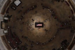WASHINGTON, DC - DECEMBER 4:  Members of the public file through the Capitol Rotunda to view the flag-draped casket of the late former President George H.W. Bush as he lies in state on December 4, 2018 in Washington, DC. A WWII combat veteran, Bush served as a member of Congress from Texas, ambassador to the United Nations, director of the CIA, vice president and 41st president of the United States. Bush will lie in state in the U.S. Capitol Rotunda until Wednesday morning. (Photo by Morry Gash - Pool/Getty Images)