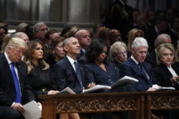 WASHINGTON, DC - DECEMBER 05: (AFP OUT) From left, President Donald Trump, first lady Melania Trump, former President Barack Obama, former first lady Michelle Obama, former President Bill Clinton and former Secretary of State Hillary Clinton listen during a state funeral for former U.S. President George H. W. Bush at the Washington National Cathedral on December 5, 2018 in Washington, DC. President Bush will be buried at his final resting place at the George H.W. Bush Presidential Library at Texas A&amp;M University in College Station, Texas. A WWII combat veteran, Bush served as a member of Congress from Texas, ambassador to the United Nations, director of the CIA, vice president and 41st president of the United States. (Photo by Alex Brandon - Pool/Getty Images)