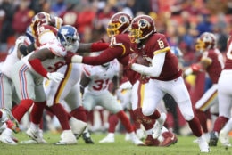 LANDOVER, MD - DECEMBER 09: Quarterback Josh Johnson #8 of the Washington Redskins carries the ball in the fourth quarter against the New York Giants at FedExField on December 9, 2018 in Landover, Maryland. (Photo by Rob Carr/Getty Images)