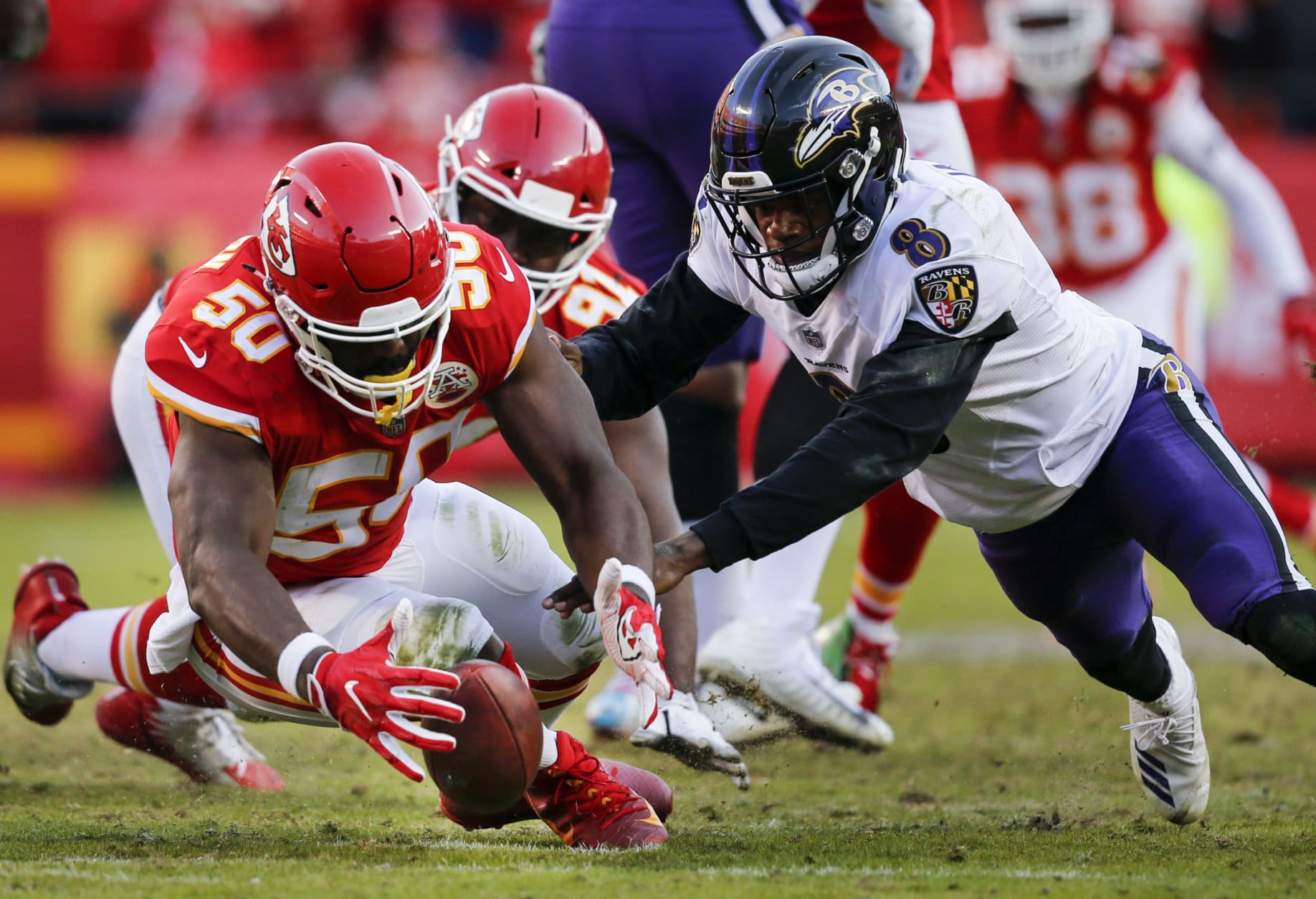 KANSAS CITY, MO - DECEMBER 09: Outside linebacker Justin Houston #50 of the Kansas City Chiefs strips the football from quarterback Lamar Jackson #8 of the Baltimore Ravens late in the fourth quarter at Arrowhead Stadium on December 9, 2018 in Kansas City, Missouri. The Chiefs won in overtime, 27-24. (Photo by David Eulitt/Getty Images)
