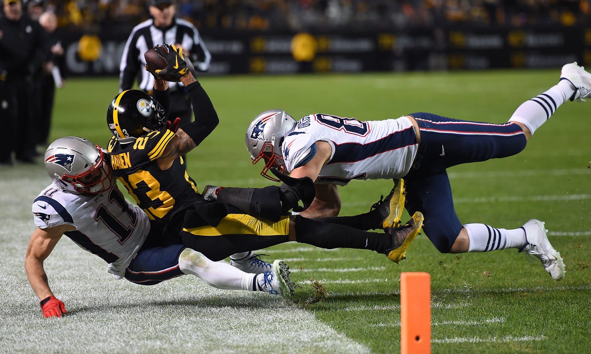 PITTSBURGH, PA - DECEMBER 16: Joe Haden #23 of the Pittsburgh Steelers intercepts a pass intended for Julian Edelman #11 of the New England Patriots in the fourth quarter during the game at Heinz Field on December 16, 2018 in Pittsburgh, Pennsylvania. (Photo by Joe Sargent/Getty Images)