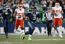 SEATTLE, WA - DECEMBER 23:  Quarterback Russell Wilson #3 of the Seattle Seahawks rushes for a first down during the first quarter of the game against the Kansas City Chiefs at CenturyLink Field on December 23, 2018 in Seattle, Washington.  (Photo by Otto Greule Jr/Getty Images)