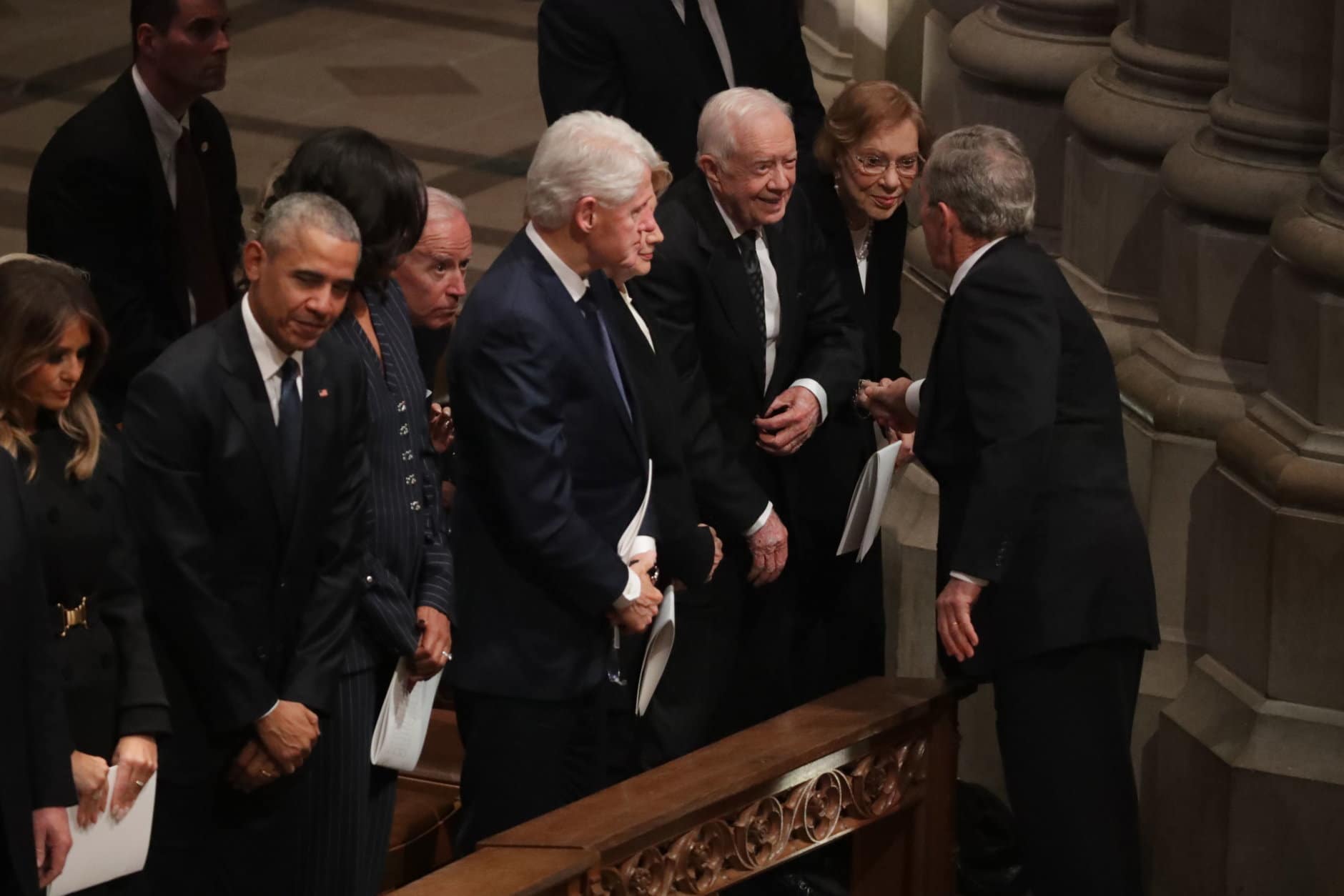 Former U.S. President George W. Bush (R) greets fellow former presidents Jimmy Carter, Bill Clinton and Barack Obama and first ladies Rosalynn Carter, Hillary Clinton, Michelle Obama and Melania Trump during the state funeral for his father and former President George H.W. Bush at the National Cathedral December 05, 2018 in Washington, DC. A WWII combat veteran, Bush served as a member of Congress from Texas, ambassador to the United Nations, director of the CIA, vice president and 41st president of the United States.  (Photo by Chip Somodevilla/Getty Images)