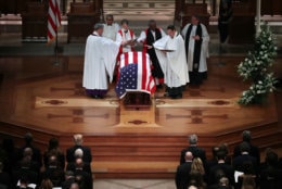 WASHINGTON, DC - DECEMBER 05:  Clergy pray over former President George H.W. Bush's flag-draped casket during his state funeral at the National Cathedral December 05, 2018 in Washington, DC. A WWII combat veteran, Bush served as a member of Congress from Texas, ambassador to the United Nations, director of the CIA, vice president and 41st president of the United States.  (Photo by Chip Somodevilla/Getty Images)