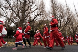 TOKYO, JAPAN - DECEMBER 23:  Participants wearing Santa Claus costumes take part in the Tokyo Great Santa Run 2018 on December 23, 2018 in Tokyo, Japan. About 5,000 people took part in the charity run event held in Tokyo for the first time where part of the participation fee goes into Christmas presents for children who have been hospitalized. (Photo by Tomohiro Ohsumi/Getty Images)