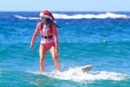 SYDNEY, AUSTRALIA - DECEMBER 25: Surfers on Bondi Beach on December 25, 2018 in Sydney, Australia. December is one of the hottest months of the year across Australia, with Christmas Day traditionally involving a trip to the beach and celebrations outdoors. (Photo by Mark Evans/Getty Images)