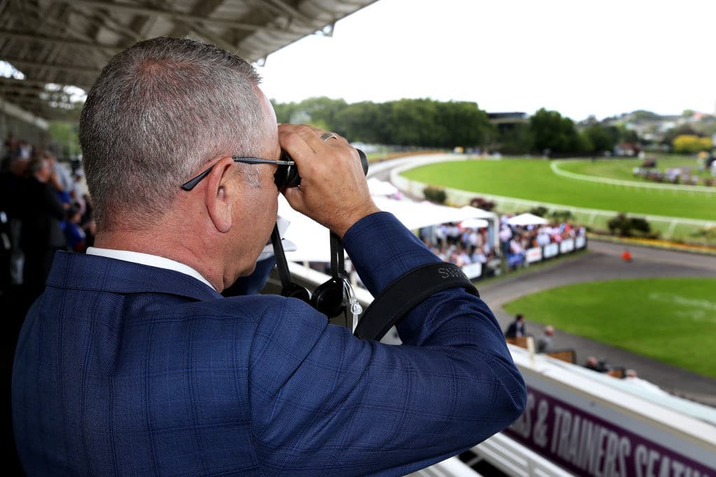 AUCKLAND, NEW ZEALAND - DECEMBER 26:  A racegoer watches the far field during the Boxing Day Races at Ellerslie Racecourse on December 26, 2018 in Auckland, New Zealand. (Photo by Dave Rowland/Getty Images)