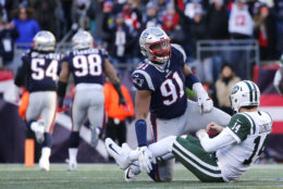 FOXBOROUGH, MASSACHUSETTS - DECEMBER 30: Sam Darnold #14 of of the New York Jets reacts after a fumble caused by Deatrich Wise Jr. #91 of the New England Patriots during the third quarter of a game at Gillette Stadium on December 30, 2018 in Foxborough, Massachusetts. (Photo by Jim Rogash/Getty Images)