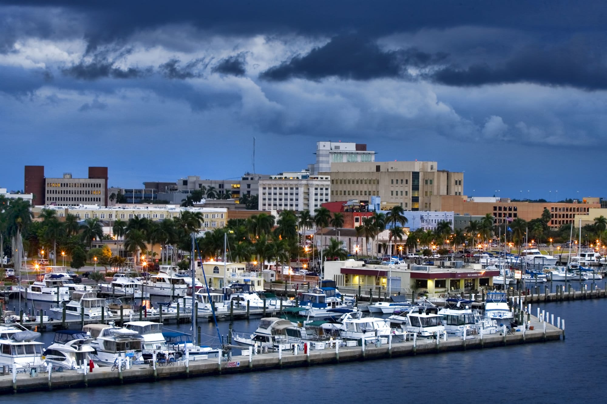 Overlooking downtown Fort Myers, Florida with the yacht basin in the foreground.  Typical summer late afternoon with storm clouds lingering.