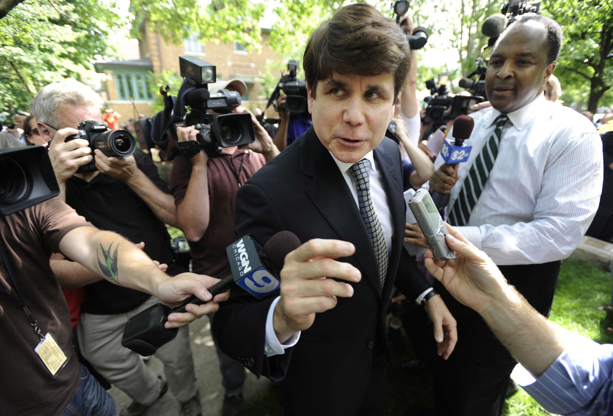 Former Illinois Gov. Rod Blagojevich greets supporters as he arrives home in Chicago, Monday, June 27, 2011, after a jury convicted him of 17 of the 20 charges against him, including all 11 charges related to his attempt to sell or trade President Barack Obama's vacated Senate seat. (AP Photo/Paul Beaty)
