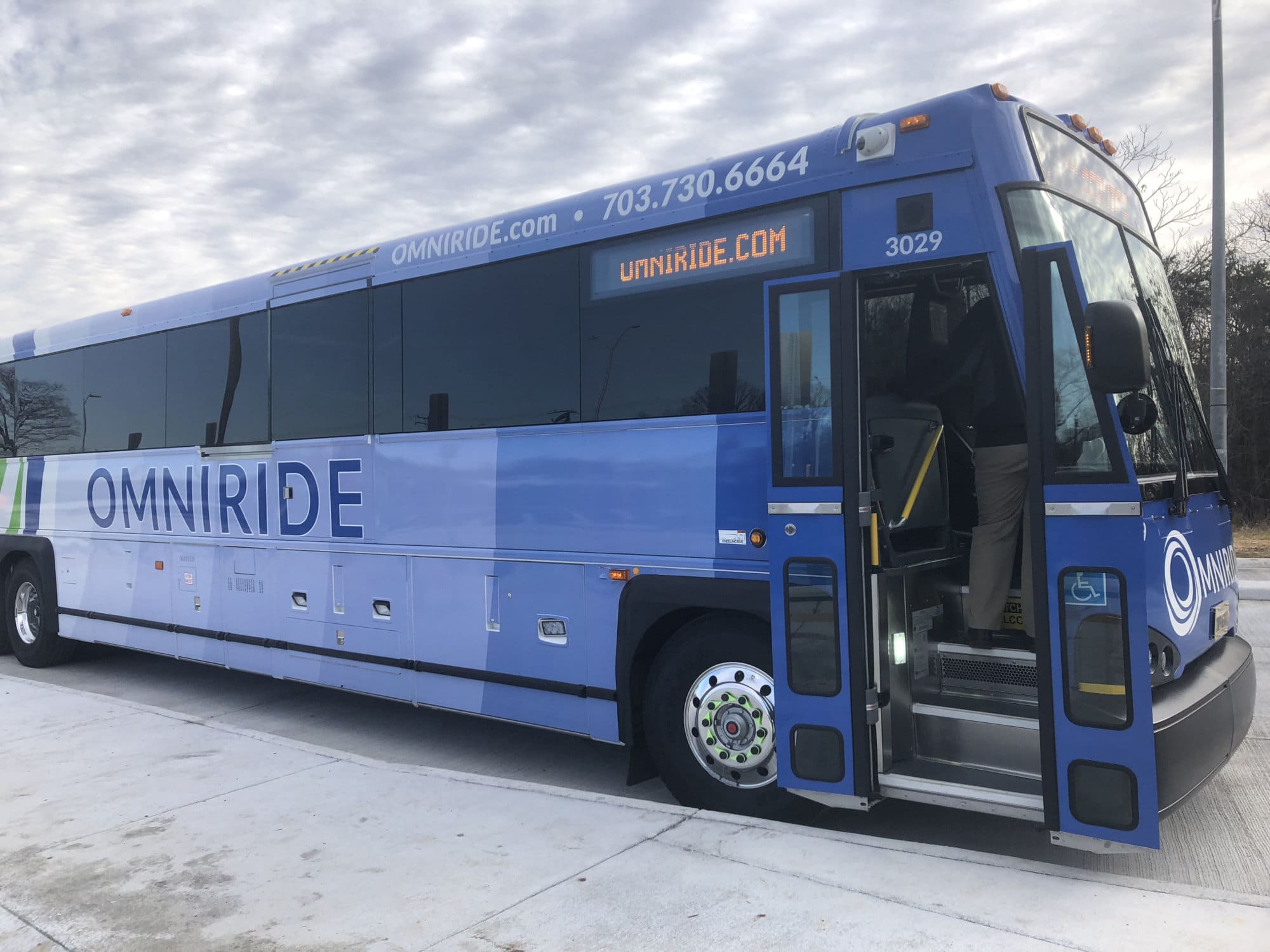 People from Gainesville, Haymarket, Warrenton, Bristow and even around Remington and Front Royal used the buses Monday, which are free into February, then half-price for the next several years. (WTOP/Max Smith)