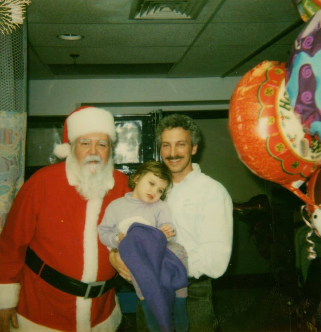 Olivia and her father Mike Lang with Santa in 2001. Olivia had recently survived a crash that left her with serious injuries and caused her to be hospitalized for more than a month. (Courtesy / Kelly Lang)