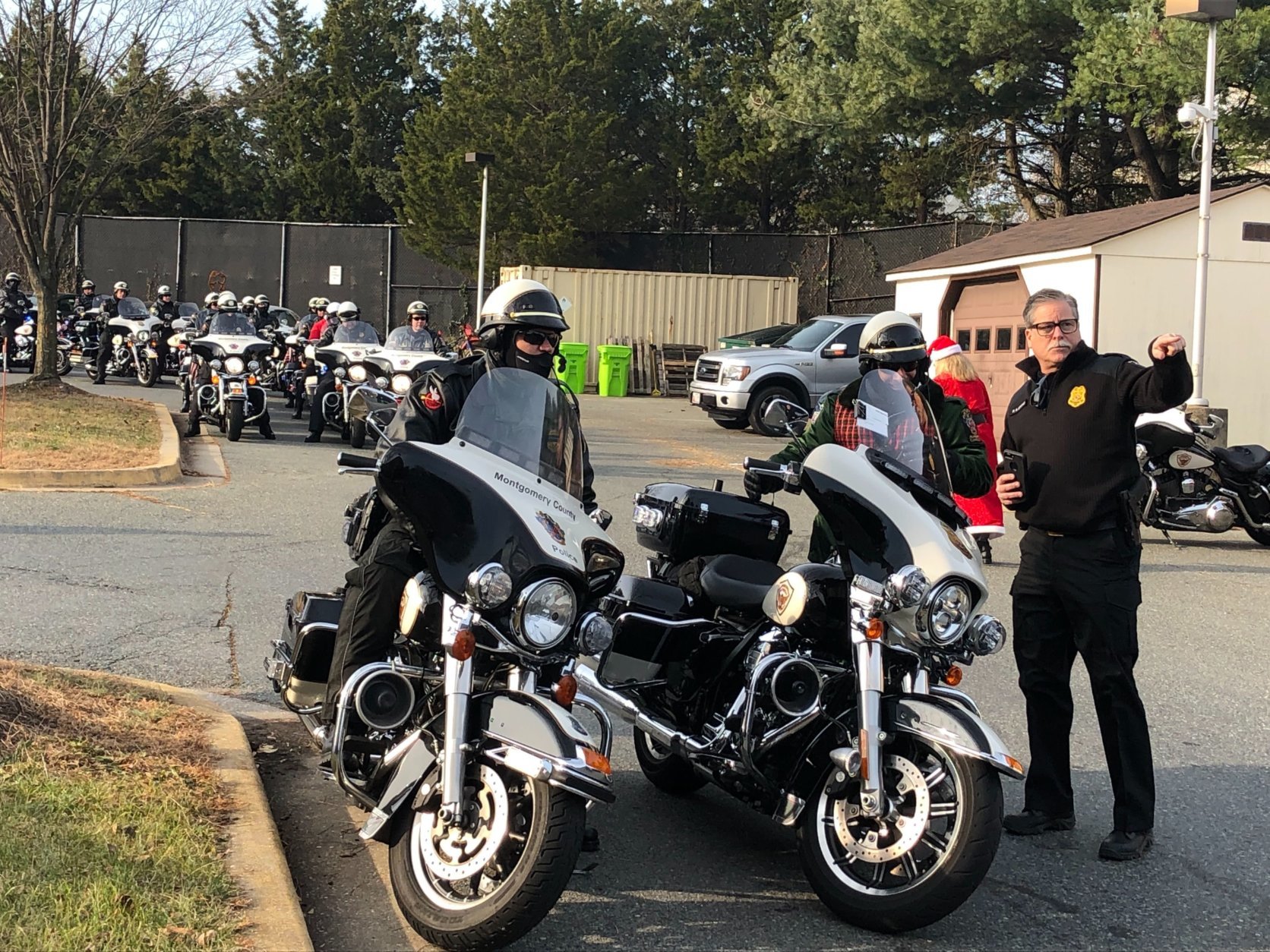 The jolly elf ditched the reindeer for Wednesday's gift run. In their place was an escort of 30 police officers on motorcycles. (WTOP/Melissa Howell)