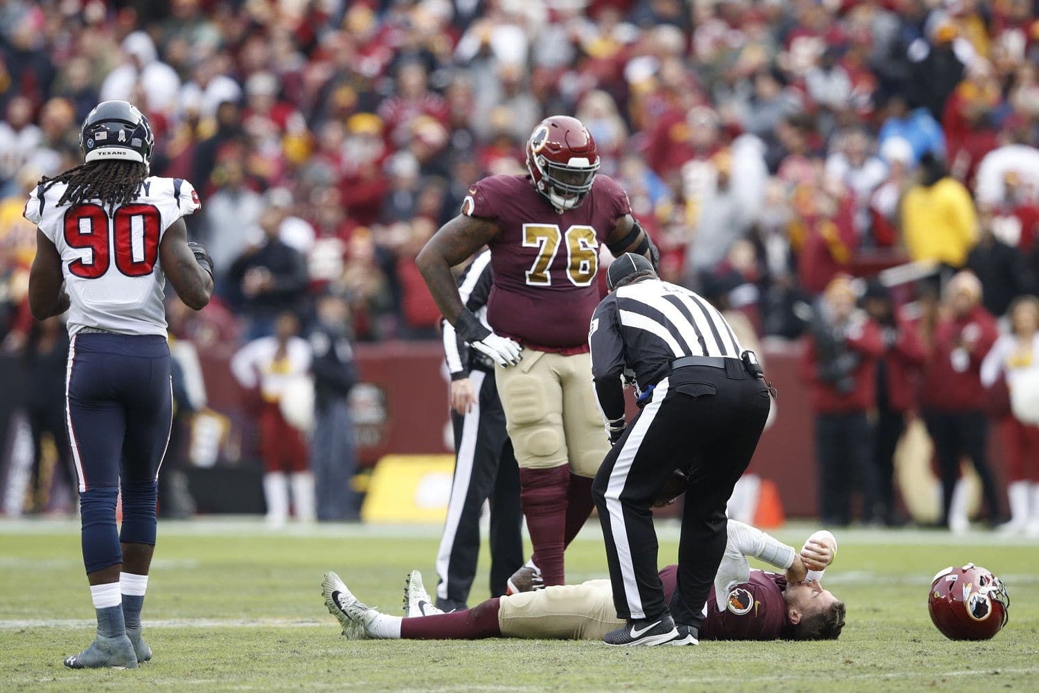LANDOVER, MD - NOVEMBER 18: Alex Smith #11 of the Washington Redskins lays on the field after being sacked and injured by Kareem Jackson #25 of the Houston Texans in the third quarter of the game at FedExField on November 18, 2018 in Landover, Maryland. (Photo by Joe Robbins/Getty Images)