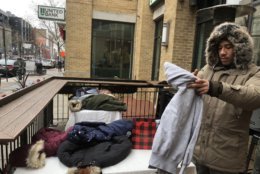 Got a spare coat to donate? The 8th Annual Warming Hearts Drive is on at Bin 1301 Wine Bar on U street. (WTOP/Melissa Howell)
