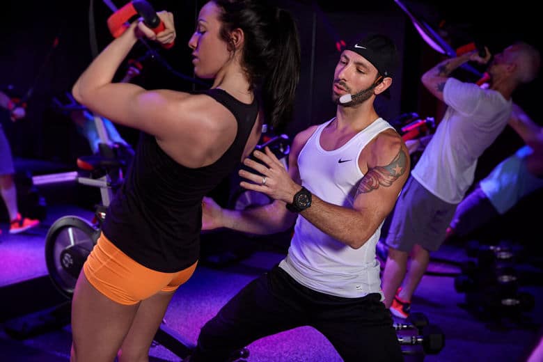 Isiah Munoz works with a client at SweatBox, an exercise studio at 1612 U St. NW. (Courtesy SweatBox)