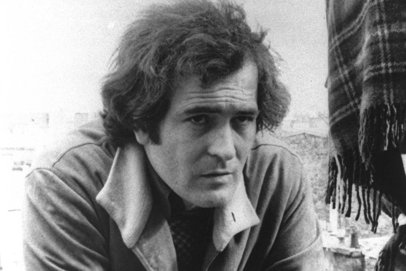 FILE -  Feb. 1972 file photo of Italian movie director Bernardo Bertolucci. Bertolucci, who won Oscars with "The Last Emperor" and whose erotic drama "Last Tango in Paris" enthralled and shocked the world, has died at the age of 77. Bertolucci's press office, Punto e Virgola, confirmed the death Monday, Nov. 26, 2018, in an email to The Associated Press. (AP Photo)
