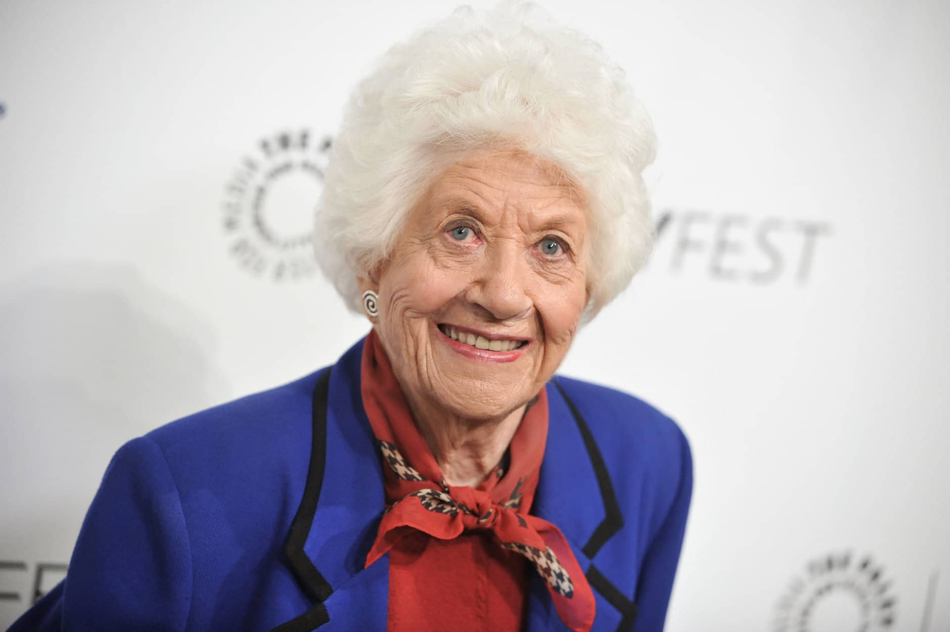 FILE - In this Sept. 15, 2014, file photo, Charlotte Rae arrives at the 2014 PALEYFEST Fall TV Previews - "The Facts Of Life" Reunion in Beverly Hills, Calif. Rae recounts in her new autobiography, her own life bore little resemblance to the sitcom-grade serenity of her "Facts of Life" character, Edna Garrett, instead marked by challenges that included son Andys autism and her husband's late-in-life disclosure that he was bisexual and wanted an open marriage. (Photo by Richard Shotwell/Invision/AP, FILE)