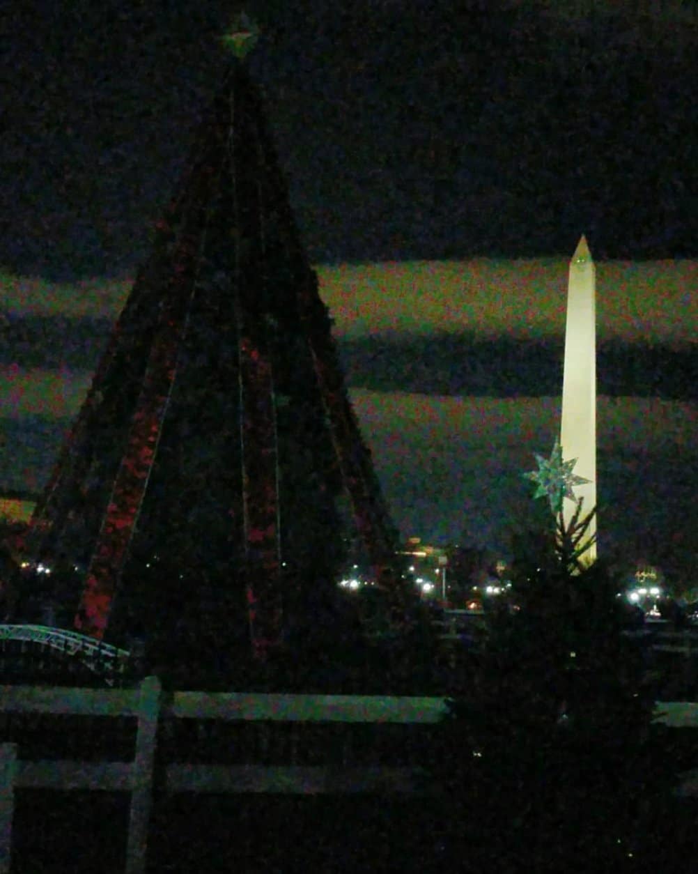 An unlit National Christmas Tree is seen with the National Monument behind it. (Courtesy Shirley Courteau)