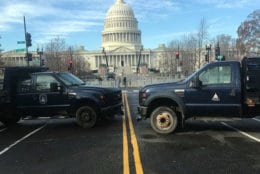 Official vehicles barricade part of the way along East Capitol Street in D.C. (WTOP/Mitchell Miller)