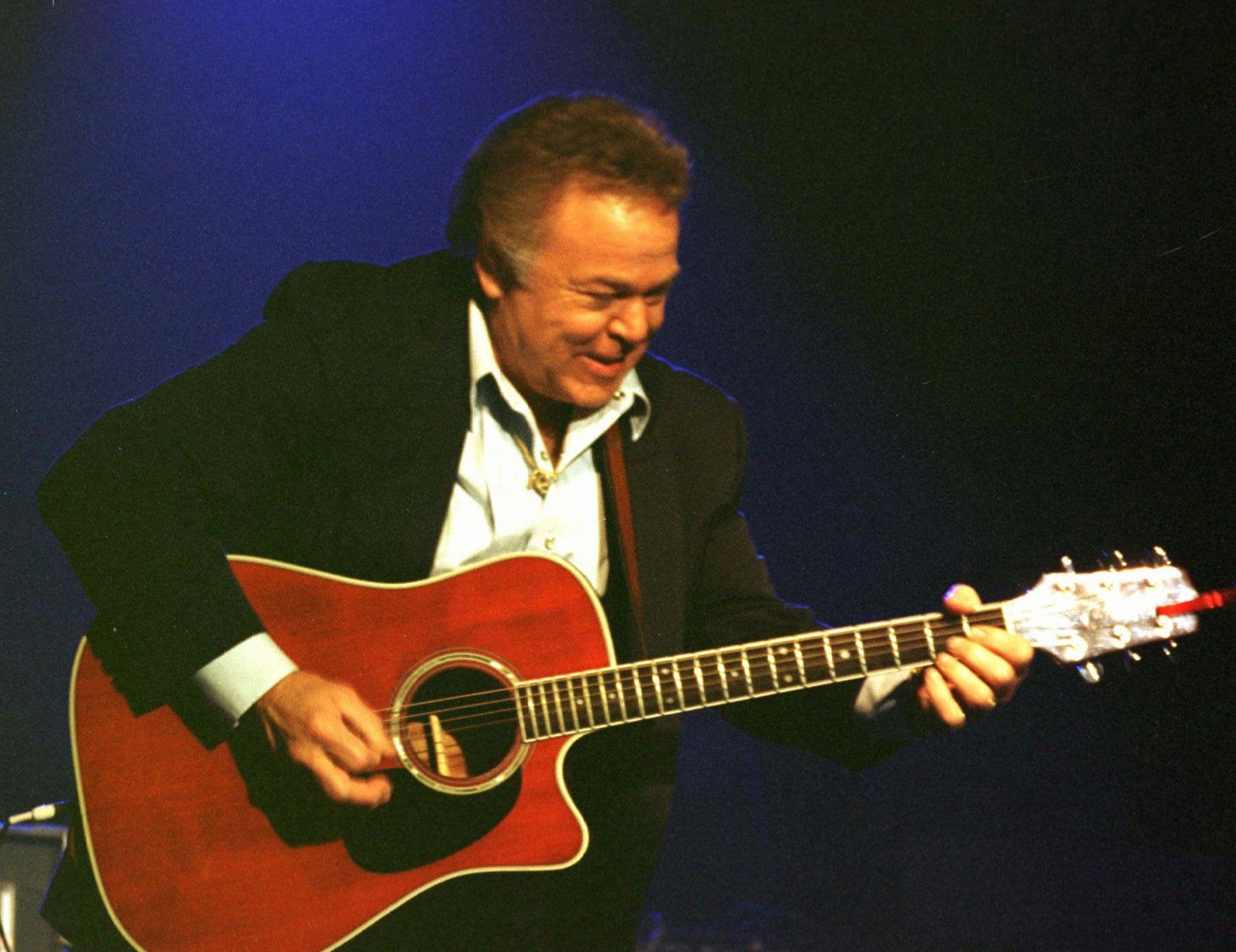Roy Clark picks his way through a performance at his theater in Branson, Mo., Oct. 14, 1996. Clark was the first big name to have a theater in Branson and lead the way for others to come. He gives his last performance in Branson next month.  (AP Photo/John S. Stewart)