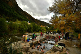 People enjoy natural thermal baths of Cidaco River on an autumn day in the small village of Arnedillo, around 60 km (37,2823 miles) from Logrono city, northern Spain, Saturday, Nov.10, 2018. (AP Photo / Alvaro Barrientos)