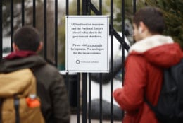 A closed sign is posted on the gate of Smithsonian's National Zoo, Wednesday, Jan. 2, 2019, in Washington. Smithsonian's National Zoo is closed due to the partial government shutdown. President Donald Trump is convening a border security briefing Wednesday for Democratic and Republican congressional leaders as a partial government shutdown over his demand for border wall funding entered its 12th day. (AP Photo/Carolyn Kaster)