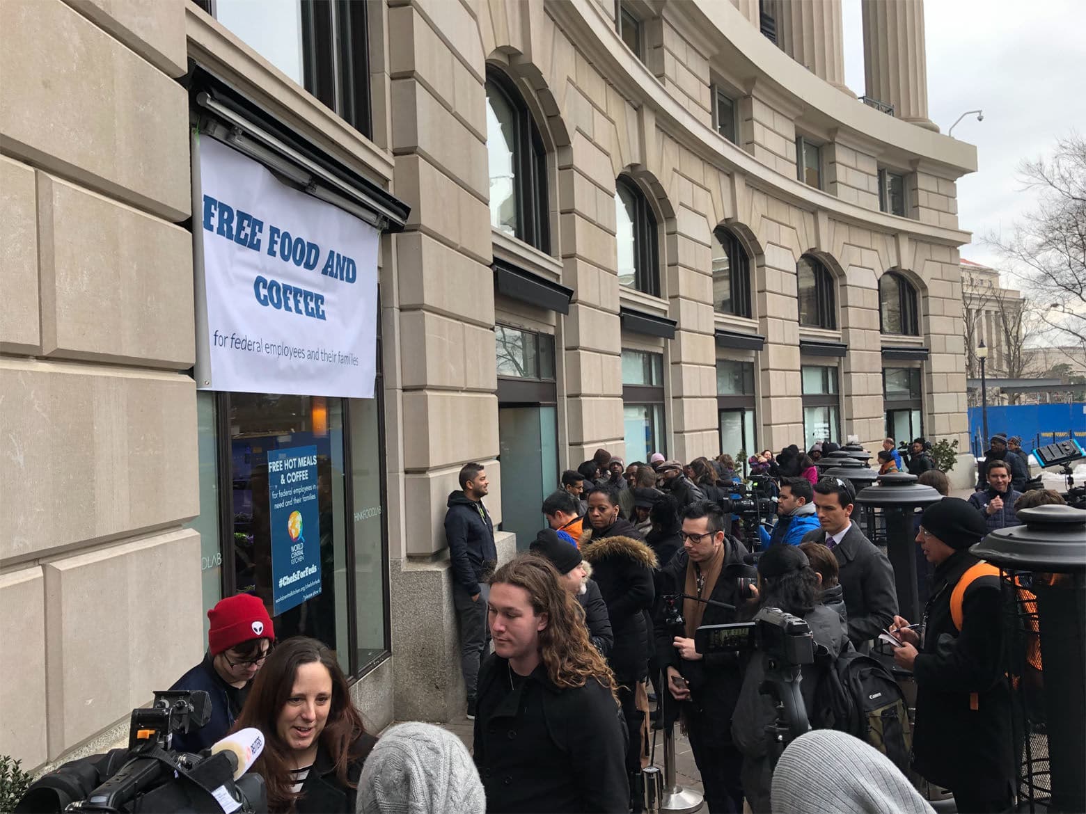 Federal employees and contractors who aren't getting paid because of the shutdown are lining up for free, hot, gourmet meals from the charity founded by Chef Andres. (WTOP/Kristi King)