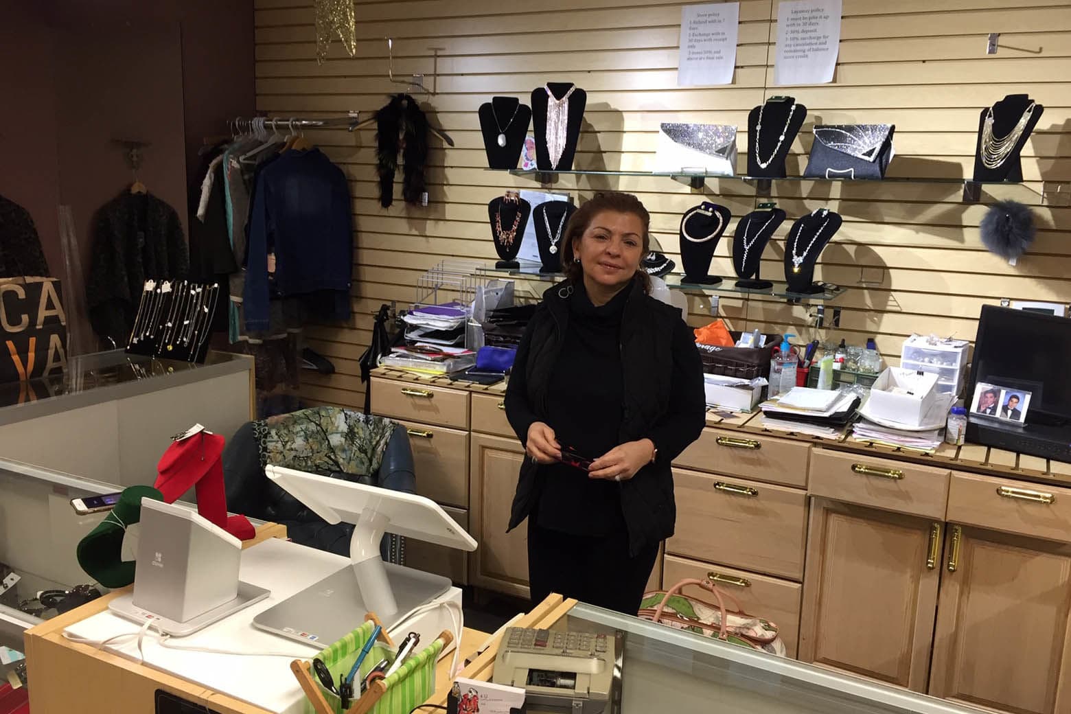 Moj Foroughi's store, 4-U, is stocked full of clothes, jewelry and other accessories. But it was empty of any customers.“Days I open and I just close with zero sales,” she lamented. “It’s been bad.” (WTOP/John Domen)