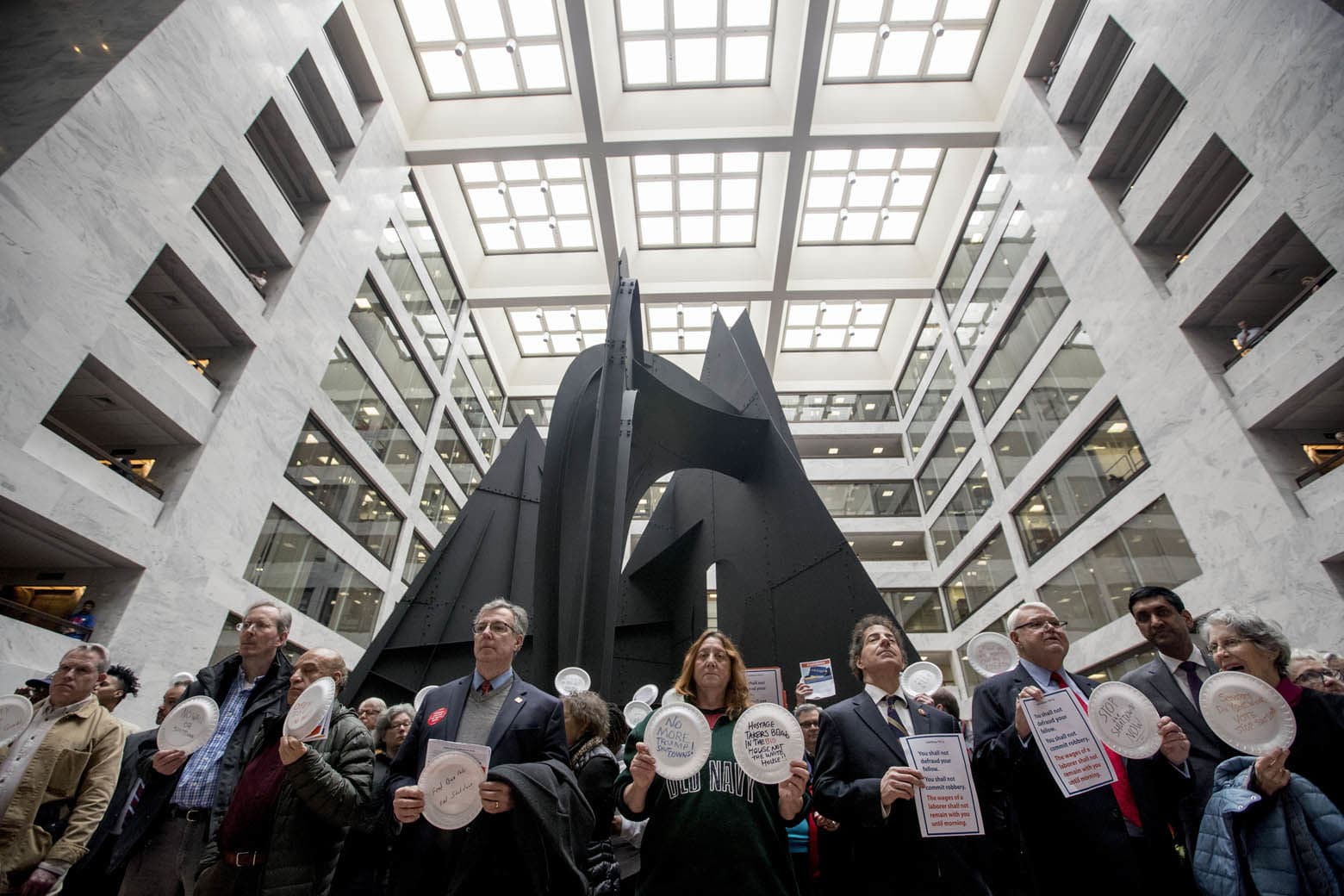 Furloughed government workers affected by the shutdown hold a silent protest against the ongoing partial government shutdown on Capitol Hill in Washington, Wednesday, Jan. 23, 2019. (AP Photo/Andrew Harnik)