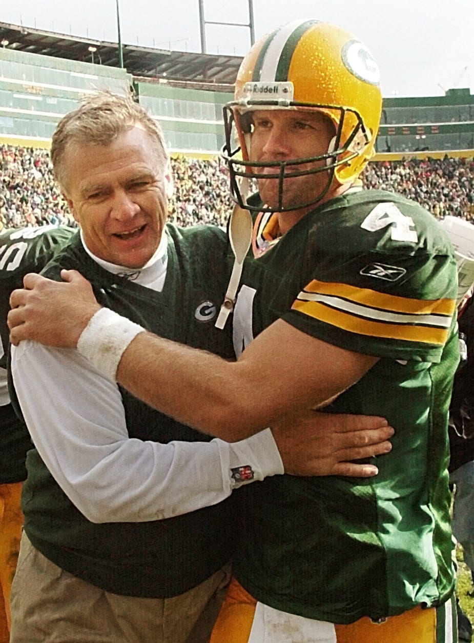 Green Bay Packers coach Mike Sherman hugs quarterback Brett Favre after their 31-23 victory over the Baltimore Ravens, Sunday, Oct. 14, 2001, in Green Bay, Wis. (AP Photo/Morry Gash)