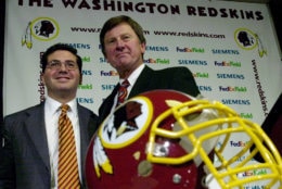 Steve Spurrier, right, is joined by Washington Redskins' owner Daniel Snyder during Spurrier's first news conference as the Redskins' head coach in Ashburn, Va  Tuesday, Jan. 15, 2002 . (AP Photo/Kenneth Lambert)