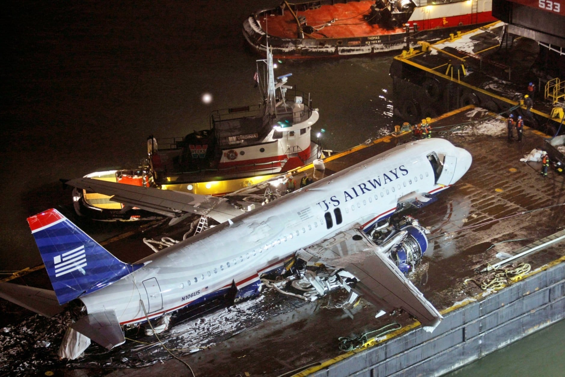 U.S. Airways flight 1549, an Airbus A320 that made an emergency landing Thursday in the Hudson River sits on a barge after being lifted out of the river in New York, Sunday, Jan. 18, 2009. (AP Photo/Kathy Willens)